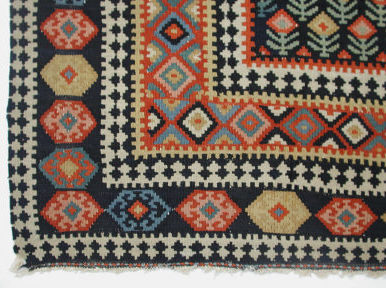 geometric, multi-banded border of Senneh prayer rug