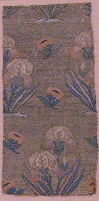 This mid-17th century Persian fabric depicts realistic white, pink and blue silk iris offset by pink and blue poppies.