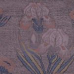 A detailed image of this silk iris textile reveals the ground weft’s neutral diamond design with the lampassed pink, yellow, blue, and white flowers on top of it.