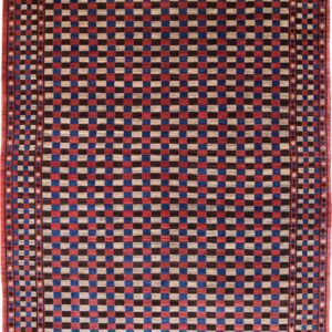 Red, Indigo, and brown checkered wool Persian carpet. This carpet is hand knotted, durable, and comfortable and measures five feet eight inches by eight feet ten inches.