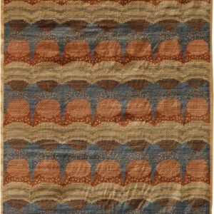 Warm red, pink and blue abstract Persian carpet featuring a circular interior pattern, measuring 9' x 12.' Hand knotted in organic wool.