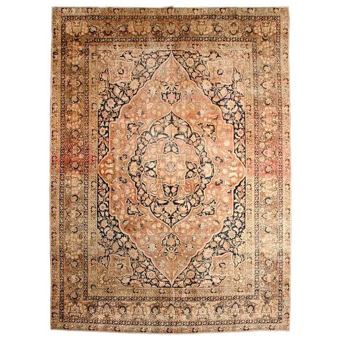 Vintage Persian rug with intricate floral patterns in beige, pink and navy.