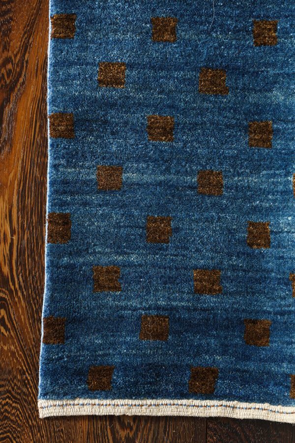 Customizable area rug in modern design using sustainable natural materials handknotted in wool with artisan craftsmanship