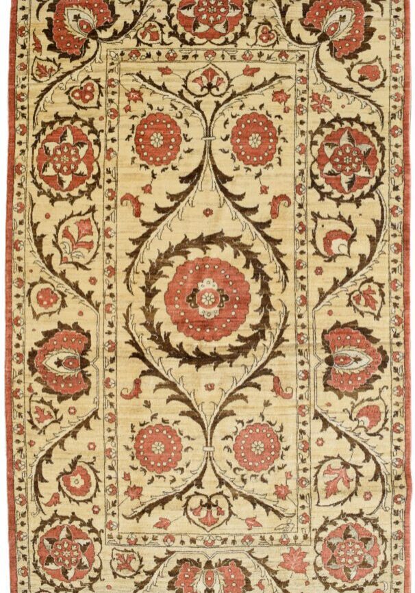 Hand-knotted transitional Persian rug in shades of cream, red, and brown.