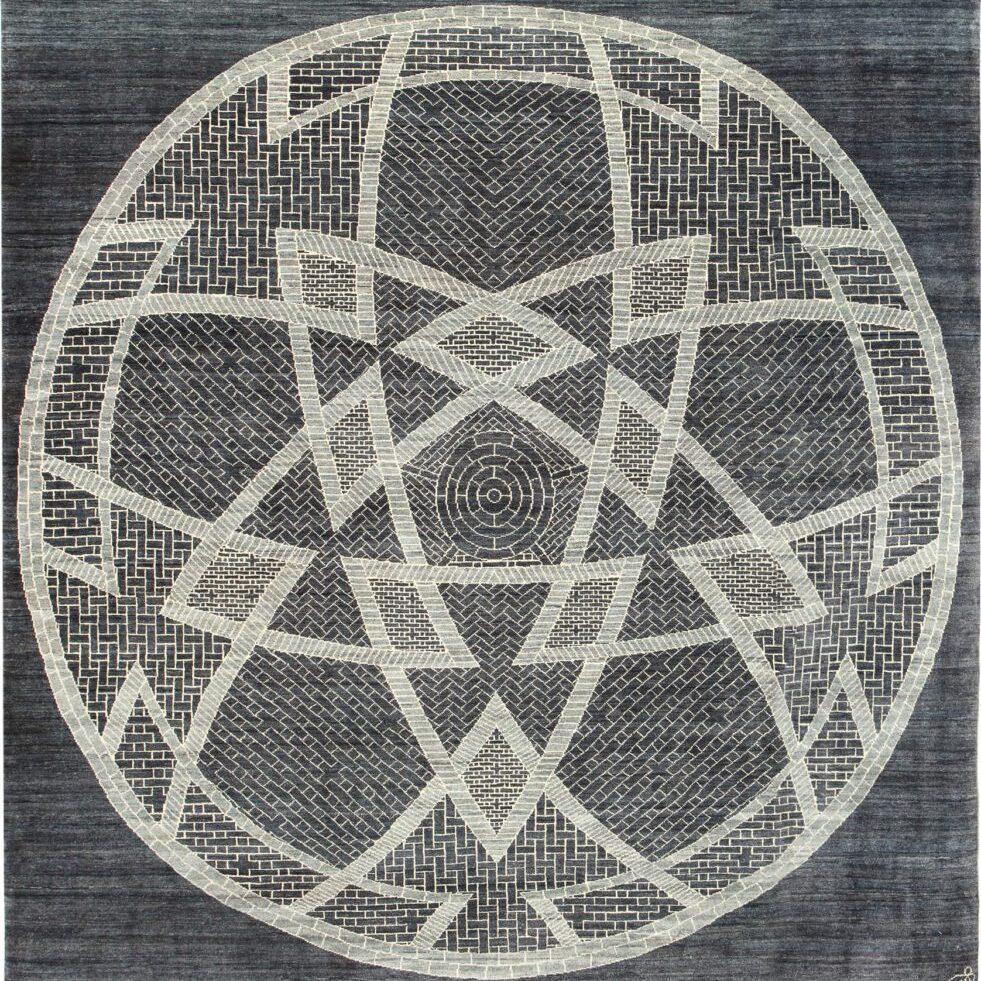 This carpet is nearly square, measuring 8’1” x 8’4,” and crafted in Orley Shabahang's own Cheshmeh weave. Like all Orley Shabahang carpets, Donya is hand-knotted using all-natural, hand-spun wool. Using traditional Persian weaving techniques, the yarn is dyed, washed, dried, faded, and then woven into the carpet. With only 3 different shades of wool, three master weavers took a total of 8 months to weave Donya. Each thread within the pile is knotted by hand onto the carpet’s cotton warp. The weaver follows the designs' parameters, and when the row is finished, the master weaver then carefully layers and pounds in the carpet’s cotton weft. The knotting and layering of the weft allows Persian carpets to hold themselves together without the use of toxic adhesives or latex, which is not only safer for you, but also the weaver.